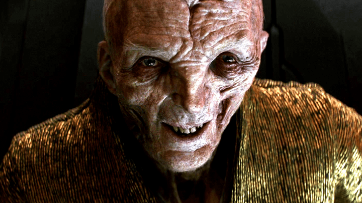 Smoke sitting down and smiling.