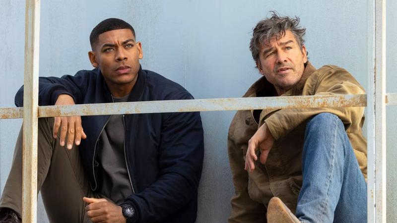 Aaron Pierre and Kyle Chandler behind the scenes of Lanterns.