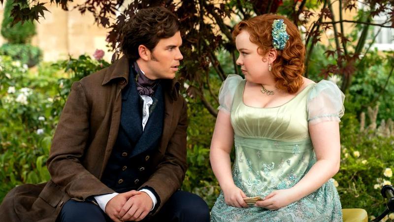Penelope Featherington and Colin Bridgerton staring into each other's eyes in Bridgerton Season 3