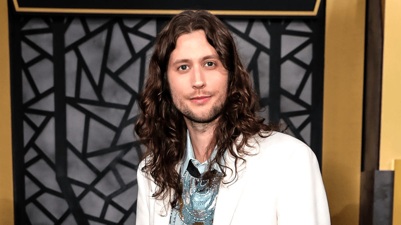 Ludwig Göransson in a white jacket and blue shirt at the world premiere for 'Black Panther: Wakanda Forever.'