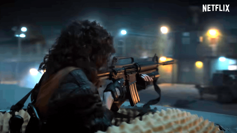 Nancy shooting some soldiers in Stranger Things Season 5