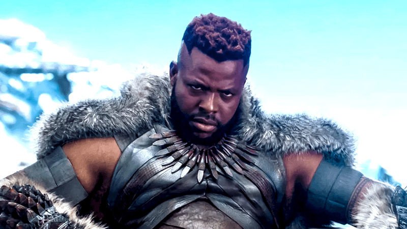 Winston Duke as M'Baku sitting on a throne in Black Panther