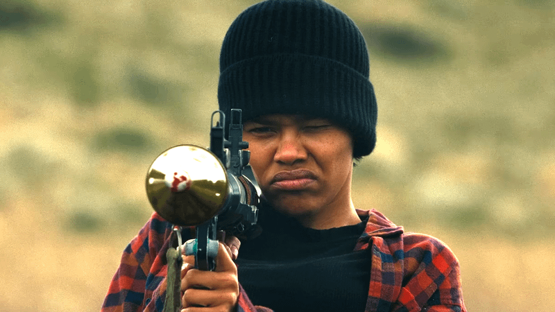 Perfidia Beverly Hills holding a rocket launcher.