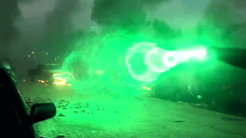 Hal Jordan fires energy blast.