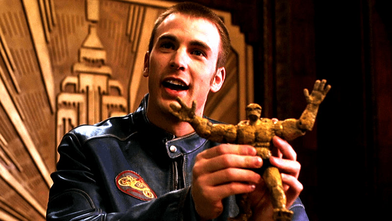 Chris Evans as Johnny Storm with a Thing action figure