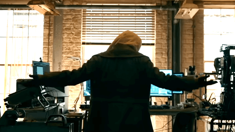 Presumably Sadie Sink wearing a hoodie with her arms out to either side.