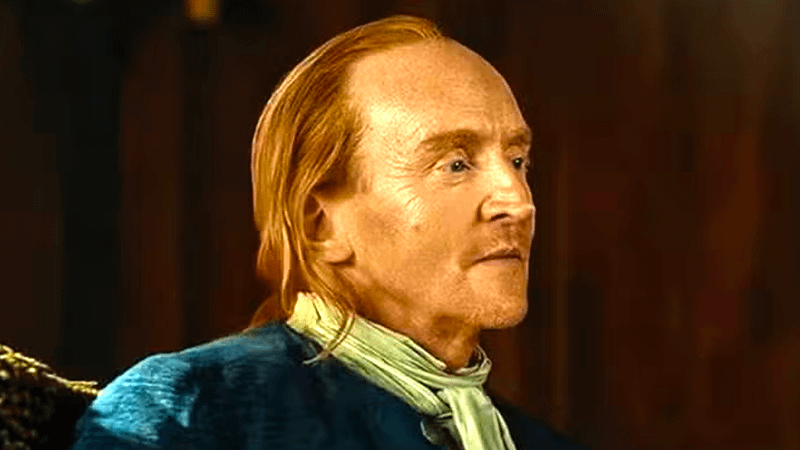 Tony Curran as Lord Lovat sitting in a chair in Outlander: Blood of my Blood