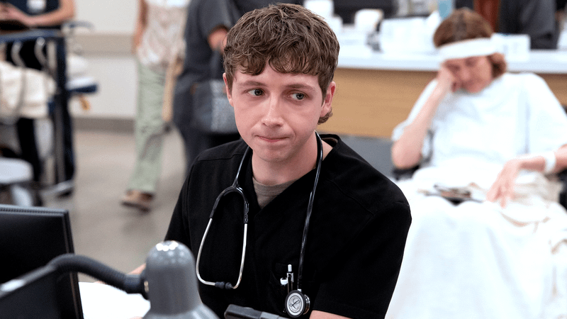 Dr. Dennis Whitaker in The Pitt Season 2.