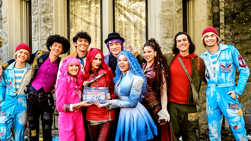 The main cast behind the scenes of Descendants: Wicked Wonderland.