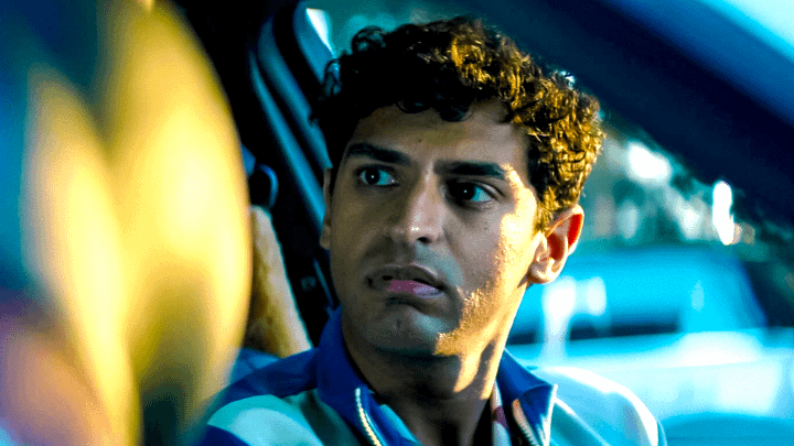 Dopinder sitting in a taxi at night in Deadpool & Wolverine.