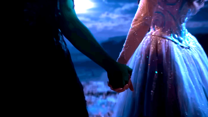 Glinda and Elphaba Holding Hands