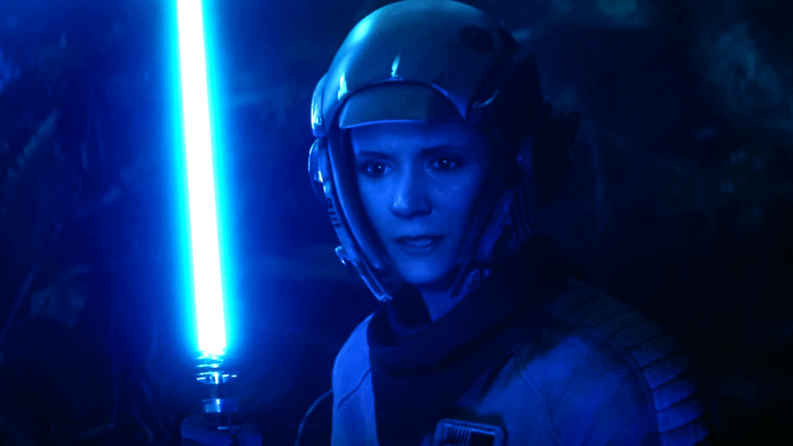 Leia Organa holding a lightsaber in The Rise of Skywalker.