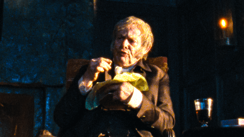 Martin Lunes as Mr Earnshaw eating in Wuthering Heights.