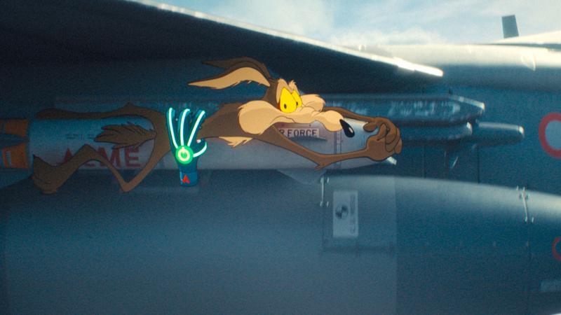 Wile E. Coyote handing on to a flying missle.