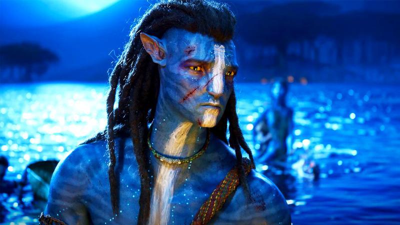 Jake Sully standing in some water in Avatar: The Way of Water
