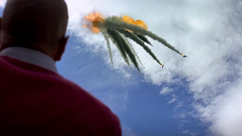 Bryan Cranston as Walter White looking up at a plane crash in Breaking Bad