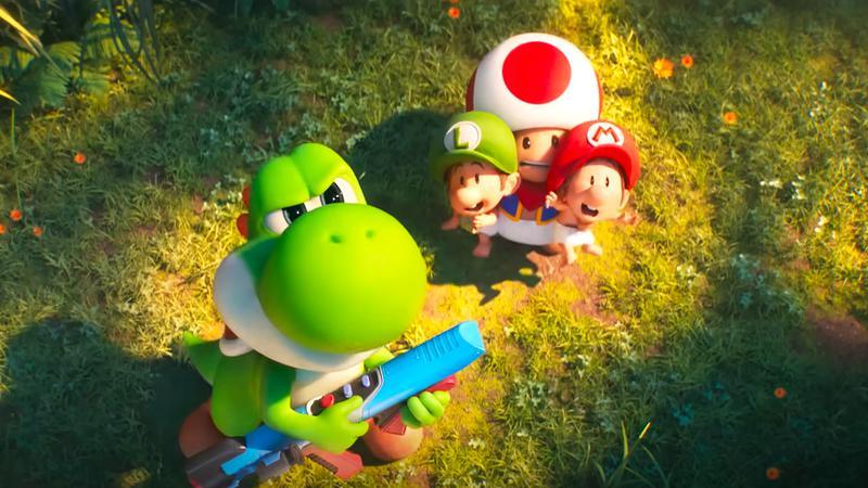 Yoshi next to Toad with Baby Mario and Luigi in his hands in The Super Mario Galaxy Movie.