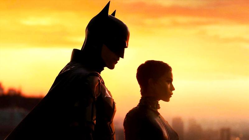 Robert Pattinson as Batman standing next to Zoe Kravitz as Catwoman in The Batman