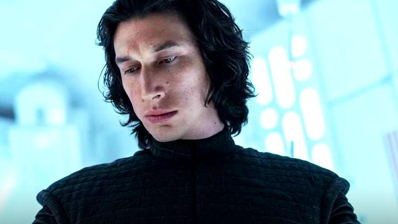Adam Driver as Kylo Ren looking downward in a white ship in Star Wars The Last Jedi