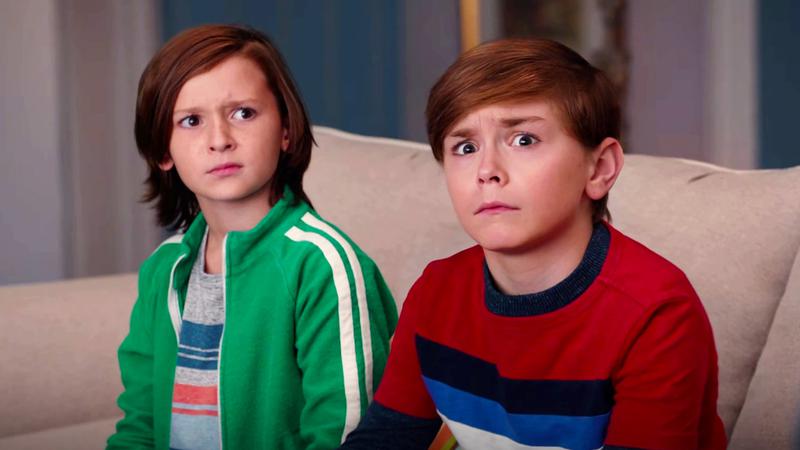 Billy and Tommy Maximoff sitting on a couch in WandaVision