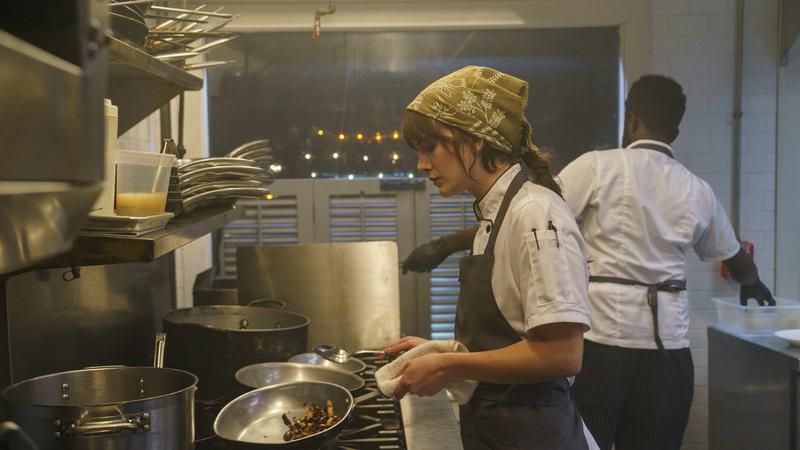 Harper cooking in Charlie Harper.