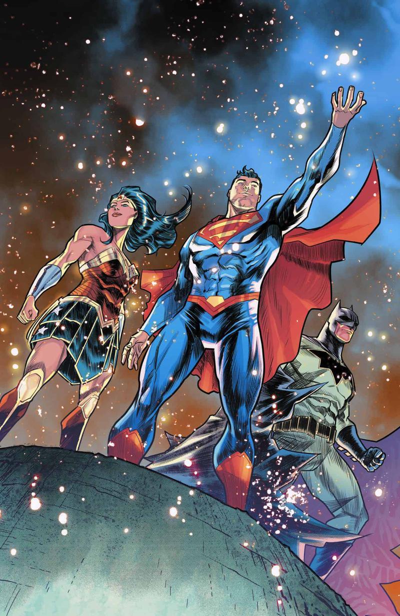 Wonder Woman, Superman, and Batman on a building looking at the sky in DC Comics