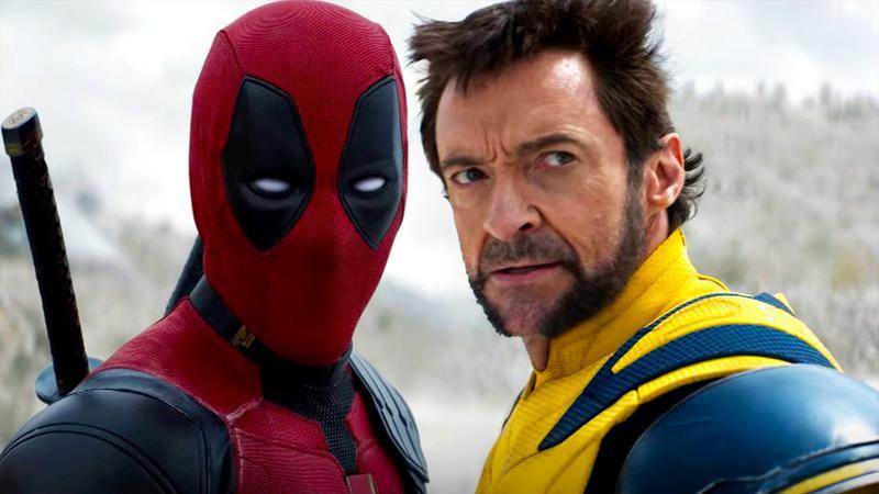 Ryan Reynolds as Deadpool standing next to Hugh Jackman as Wolverine in Deadpool & Wolverine