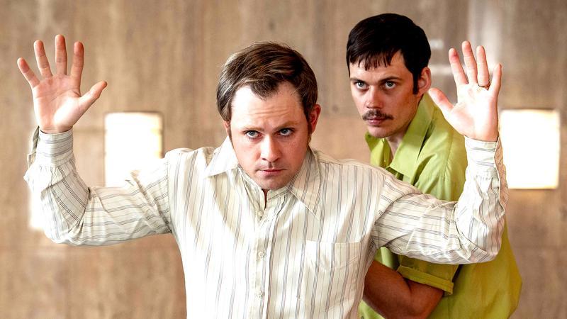 Bill Skarsgard as Tony Kiritsis and Dacre Montgomery as Richard 'Dick' Hall