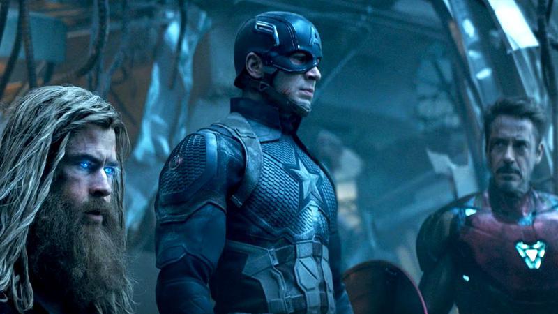 Thor, Captain America, and Iron Man standing in some rubble looking off-camera in Avengers: Endgame