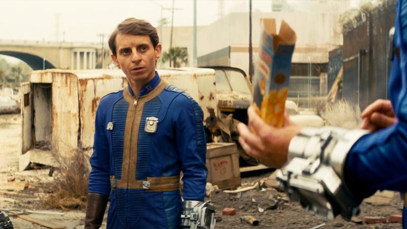 Moises Arias as Norm talking to another vault dweller in Fallout