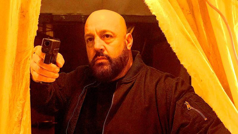 Kevin James as Ray in Guns Up