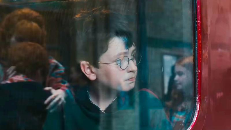 HBO Harry Potter, Ron Molly and Ginny in Hogwarts Express reflection.