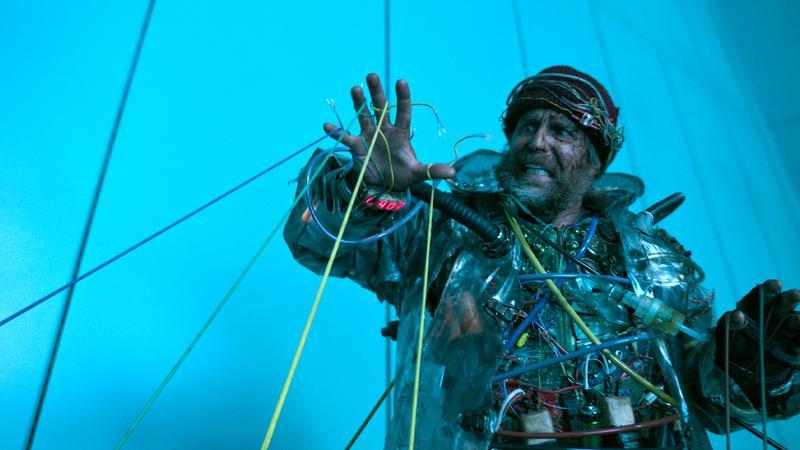 Sam Rockwell's time traveler getting attacked by wires in 'Good Luck, Have Fun, Don't Die.'
