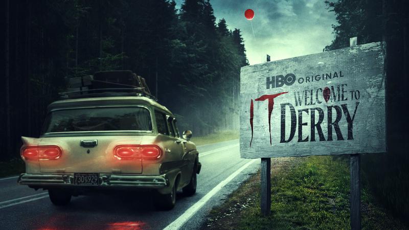 A 1960s car drives into the town of Derry.