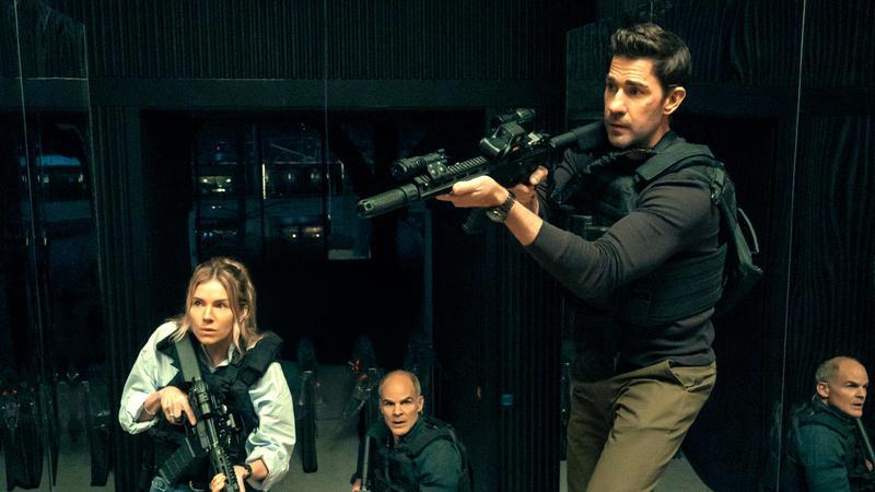 Jack Ryan aiming his gun off camera.