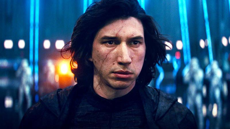 Adam Driver as Kylo Ren with his mask off standing surrounded by stormtroopers in The Rise of Skywalker