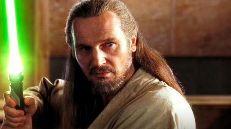 Liam Neeson as Qui-Gon Jinn holding out his saber in Star Wars: Episode I - The Phantom Menace
