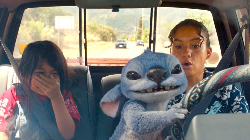 Lilo, Stitch and Nani driving a car