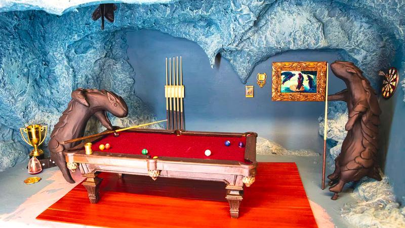 Meow Wolf Los Angeles work in progress art with a pool table in an ice cave.