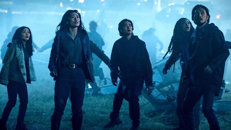 Keiko and the team looking up at Kong.