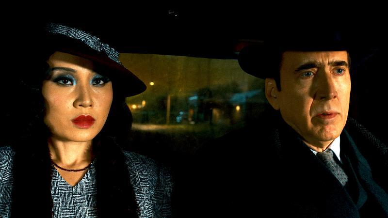 Cat Hardy and Ben Reilly in a taxi.