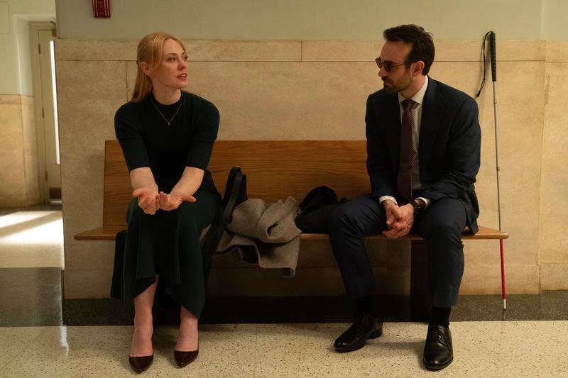 Deborah Ann Woll as Karen Page and Charlie Cox as Matt Murdock in sitting on a bench in 