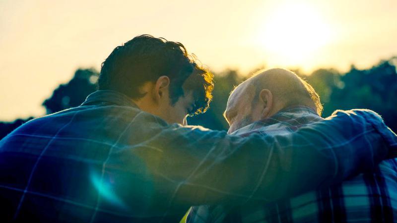 David Corenswet as Clark Kent holding Pruitt Taylor Vince as Pa Kent in Superman