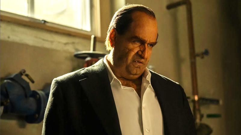 Colin Farrell as Penguin standing in a boiler room in The Penguin