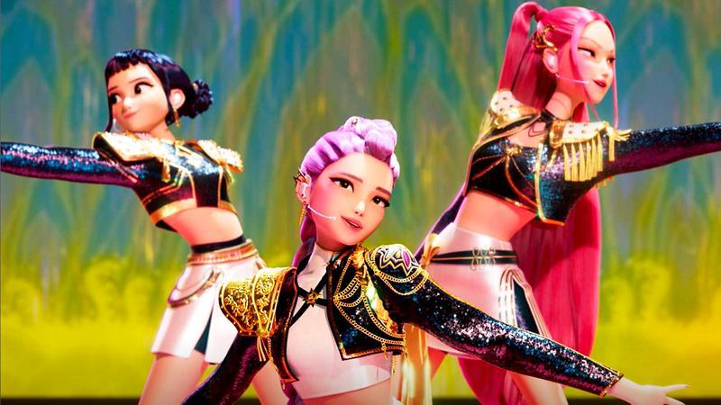 The Huntr/x girls posing together on-stage in K-Pop Demon Hunters