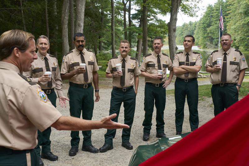 The Super Troopers and the rookie with coffees.