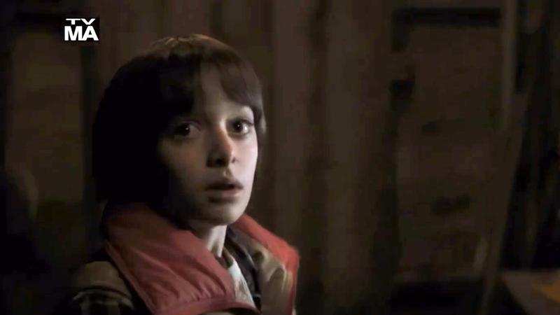 Noah Schnapp as Will Byers looking scared in Stranger Things Season 1
