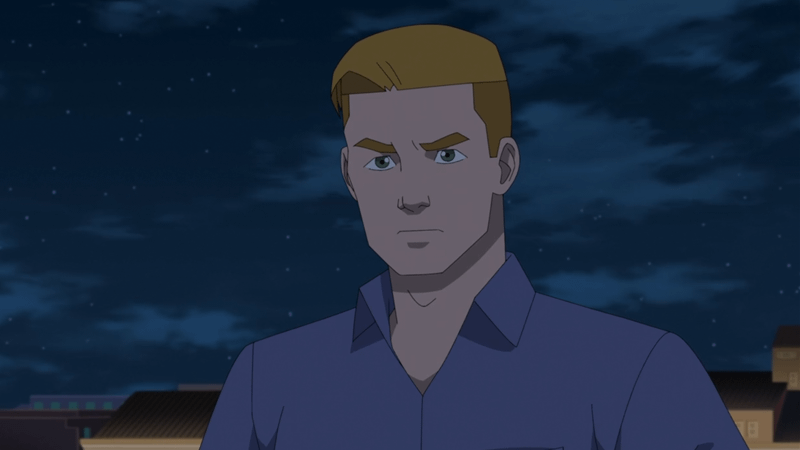 Rick Sheridan standing on a rooftop at night.