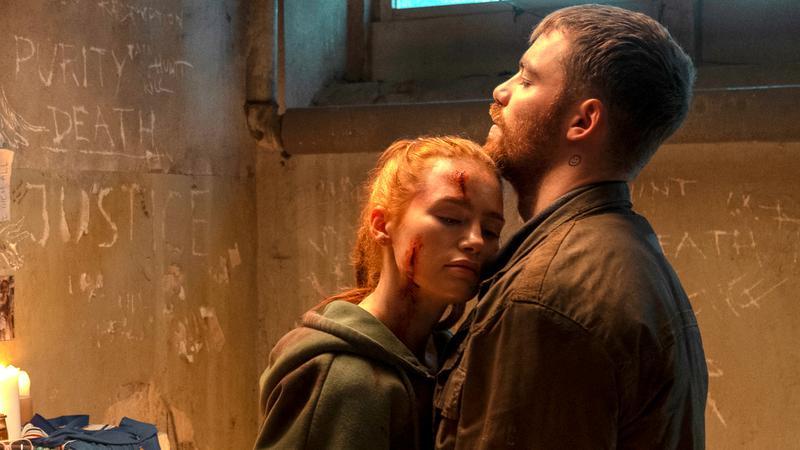 Maya in Scarecrow's arms in The Strangers: Chapter 3