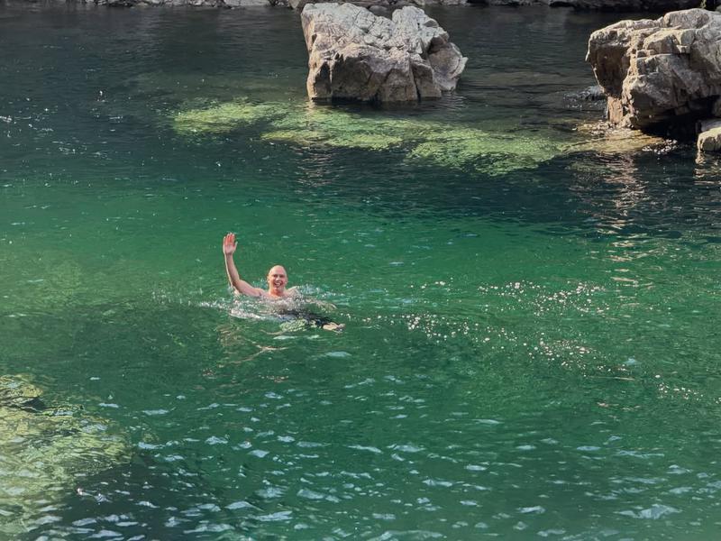 Nicholas Hoult diving in the lake.